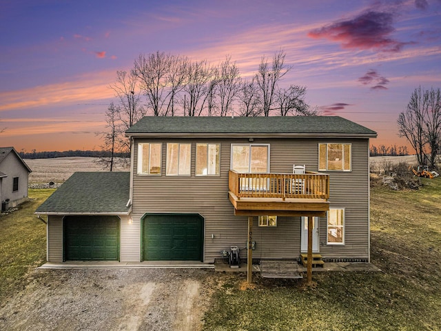 10568 Woodbrook Dr, Cement City, MI 49233 - view of front of property featuring driveway and a shingled roof