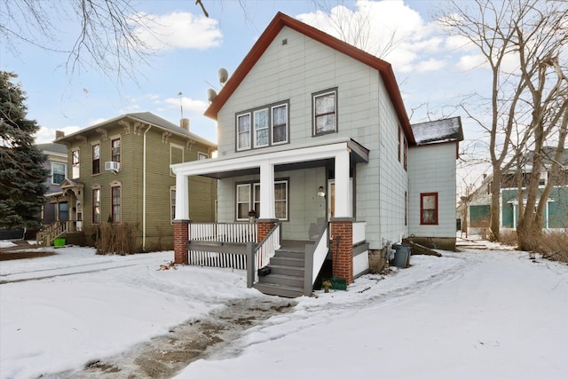 view of front of property with cooling unit and covered porch