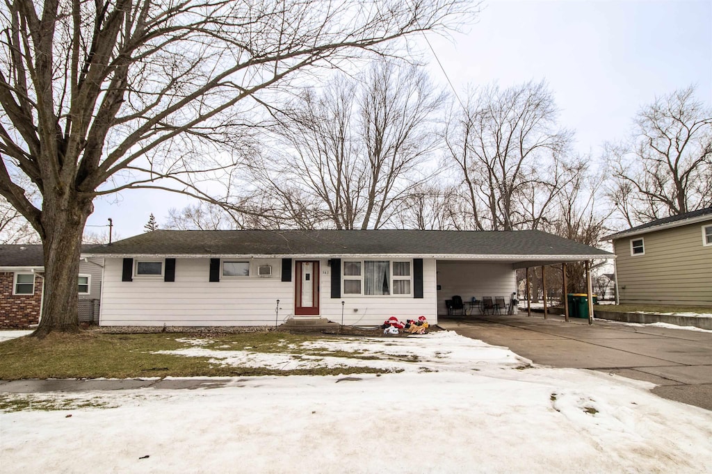 view of front of home with a carport