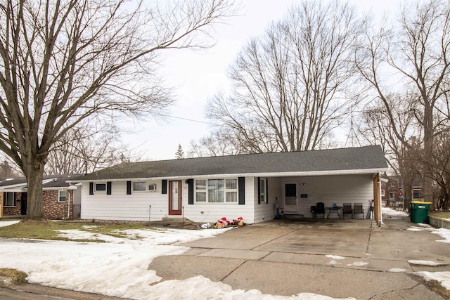 single story home featuring a carport