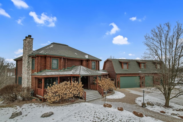 view of front facade with a garage and covered porch