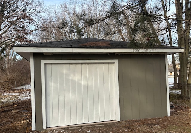 view of shed with fence