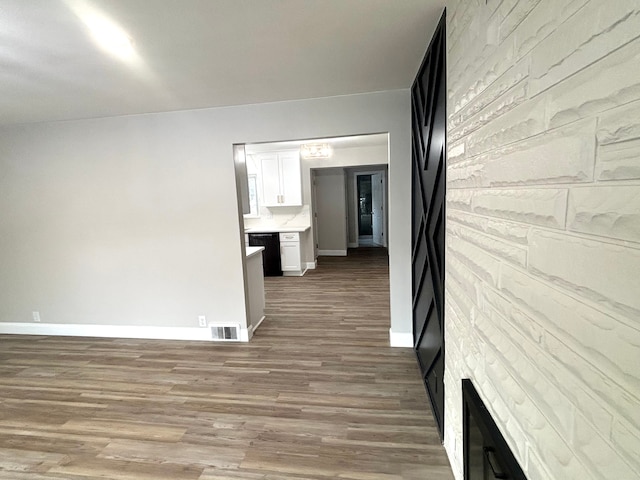 corridor featuring hardwood / wood-style flooring