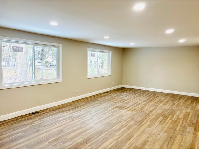 unfurnished room featuring light hardwood / wood-style flooring