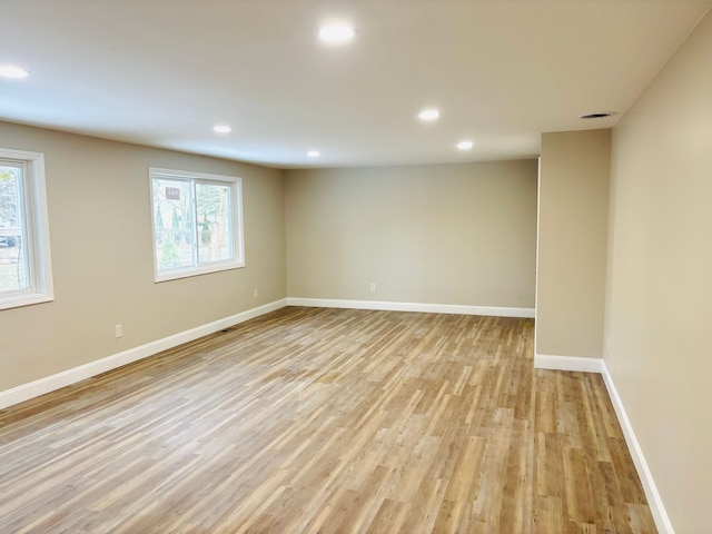 unfurnished room with recessed lighting, visible vents, baseboards, and light wood finished floors