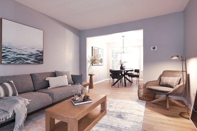 living room with an inviting chandelier and wood-type flooring