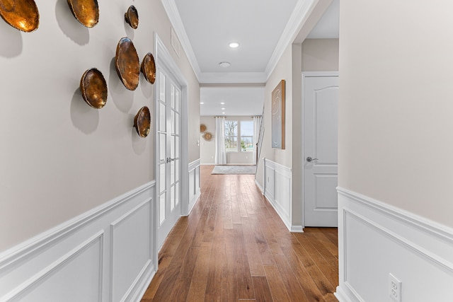 hall with crown molding and hardwood / wood-style floors