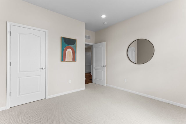 unfurnished bedroom with light carpet