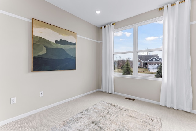 empty room with carpet flooring