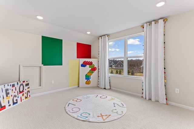 rec room with lofted ceiling and carpet