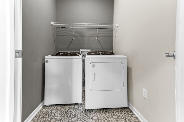 washroom with independent washer and dryer