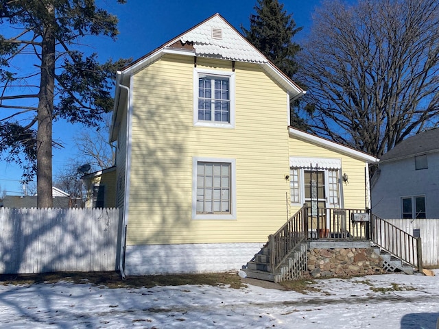 view of snow covered house