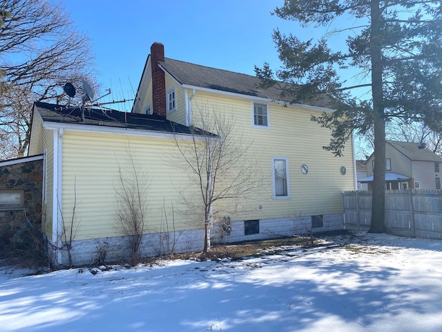 view of snow covered house