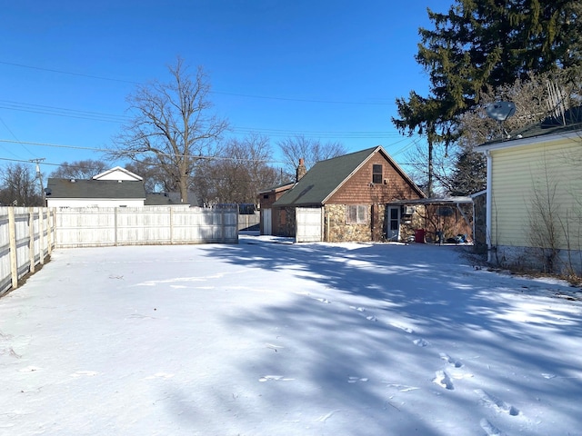 view of yard layered in snow