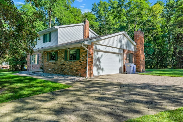 view of front of house with a garage and a front lawn