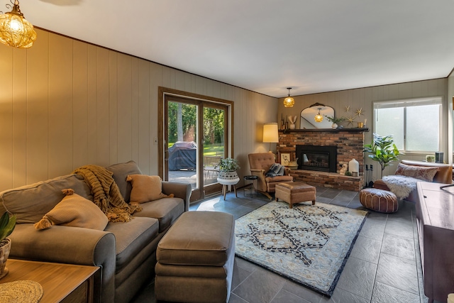 living room featuring a brick fireplace