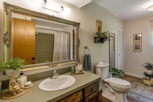 bathroom with vanity, a shower with curtain, and toilet