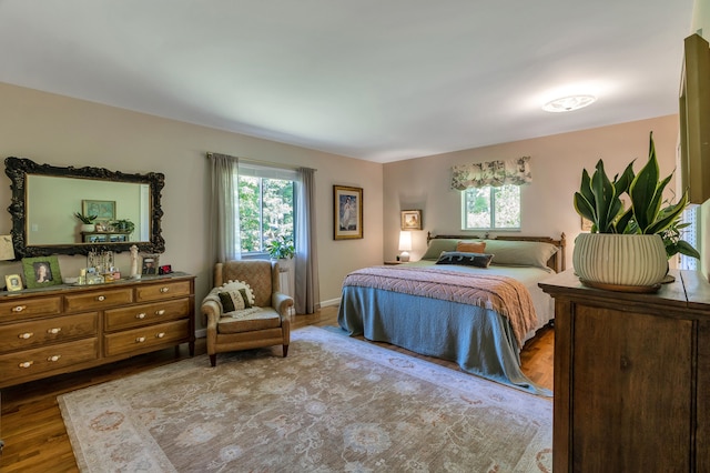 bedroom with wood-type flooring