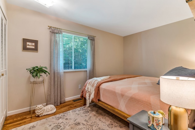 bedroom with wood-type flooring