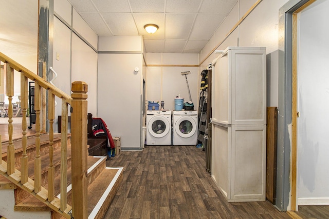 clothes washing area featuring independent washer and dryer and dark hardwood / wood-style floors