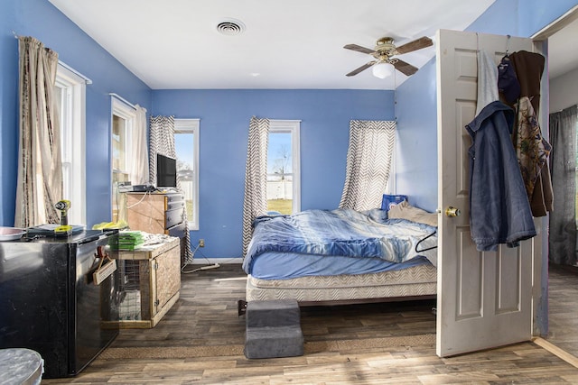 bedroom with dark wood-type flooring