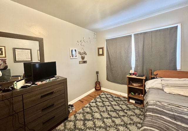 bedroom with light wood-type flooring