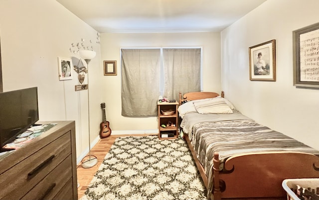 bedroom with light hardwood / wood-style flooring