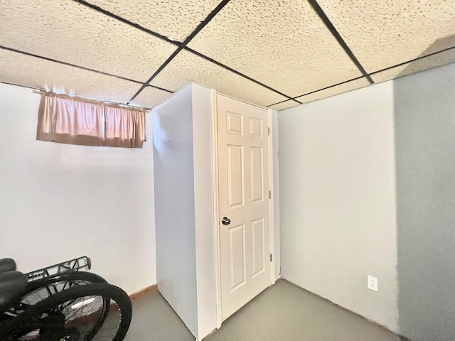 basement featuring a paneled ceiling