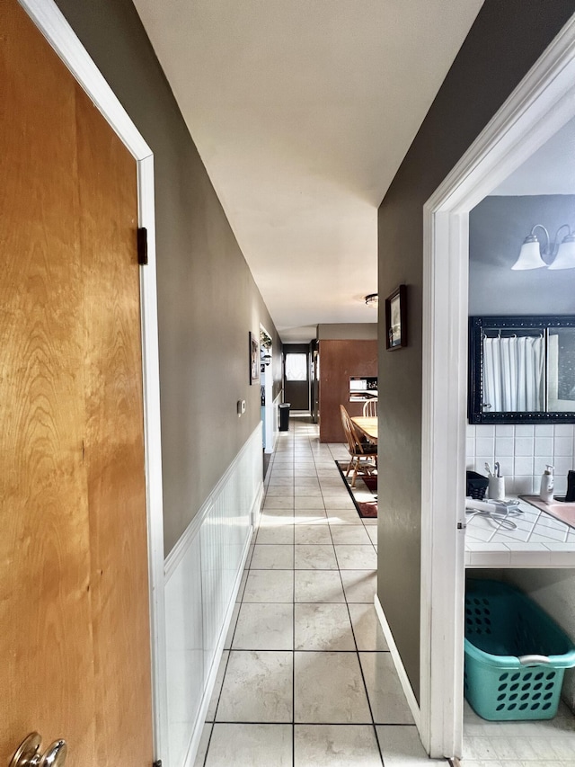 hallway featuring light tile patterned flooring