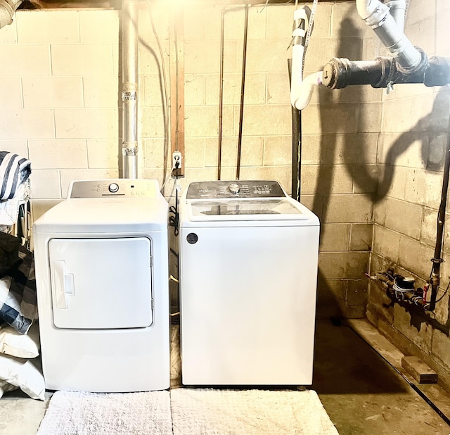 laundry area with washing machine and clothes dryer