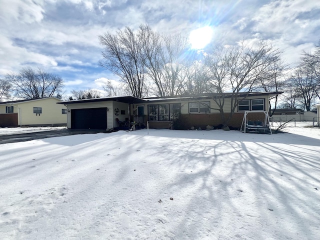 single story home featuring a garage