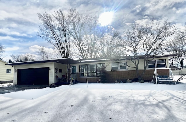 single story home featuring a garage