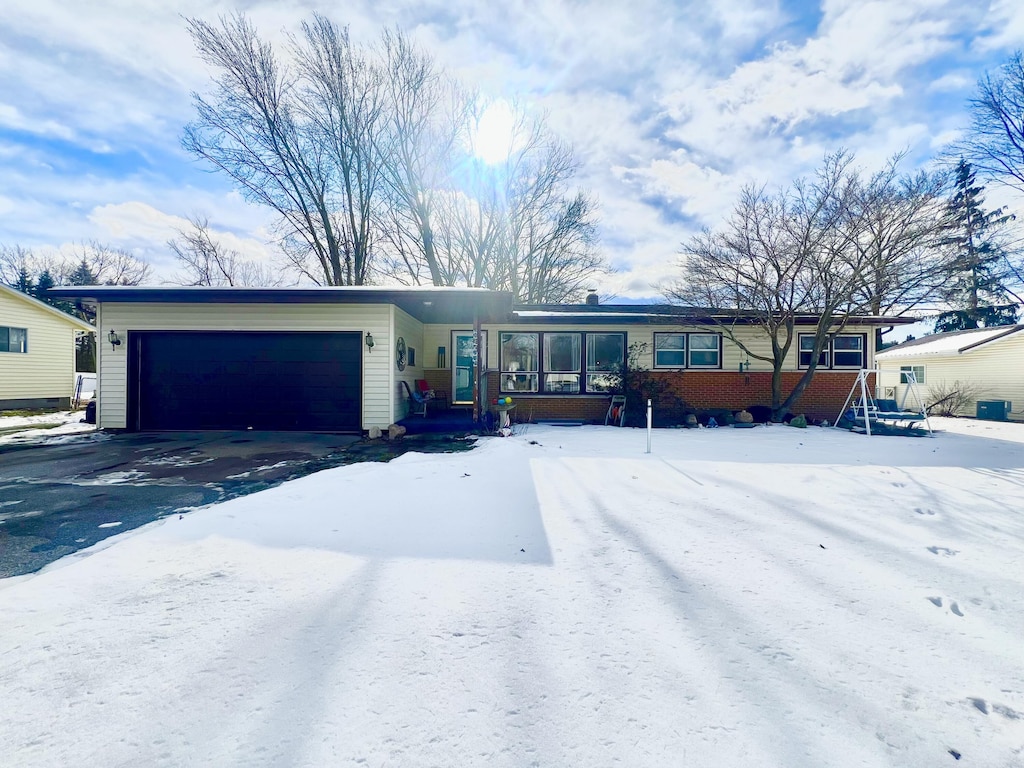 ranch-style home featuring a garage