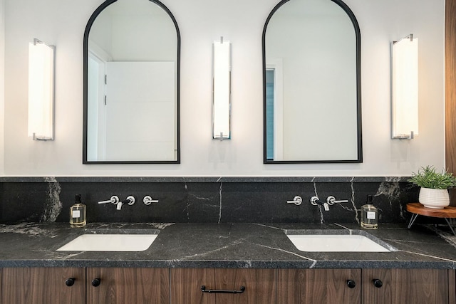 bathroom featuring vanity and decorative backsplash