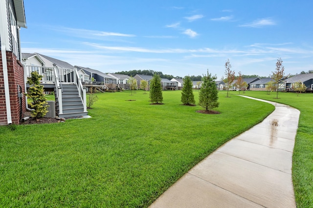 view of yard featuring a wooden deck