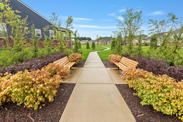 surrounding community with a yard and a patio area