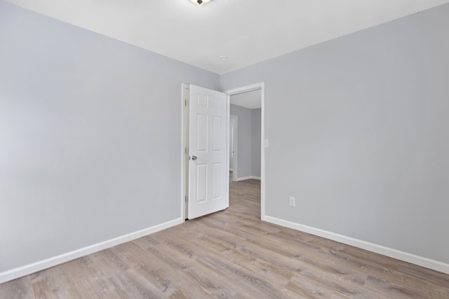 empty room with light hardwood / wood-style floors