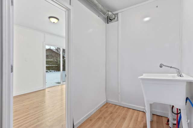 bathroom with hardwood / wood-style flooring