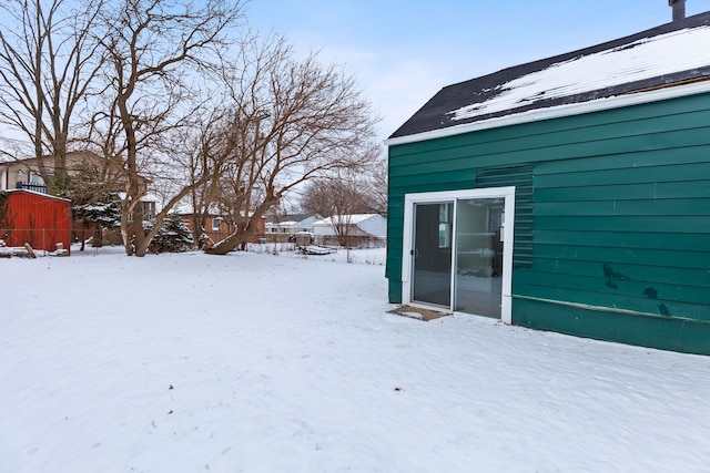 view of yard layered in snow