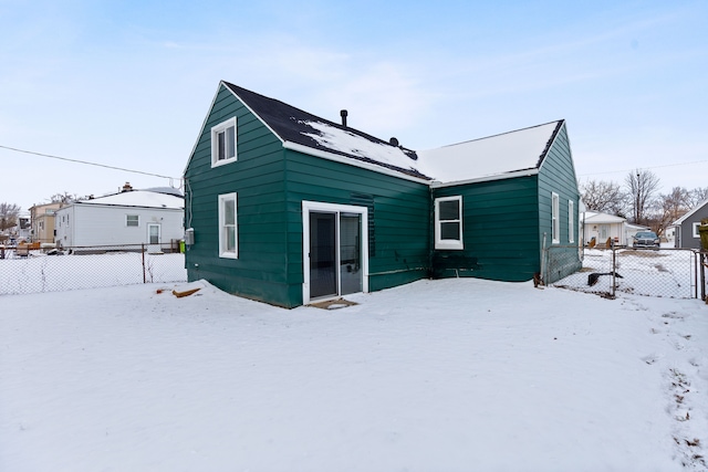 view of snow covered house