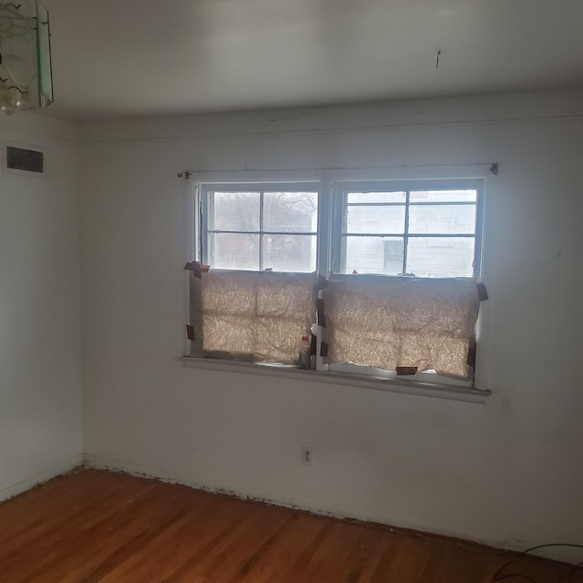 spare room with hardwood / wood-style flooring