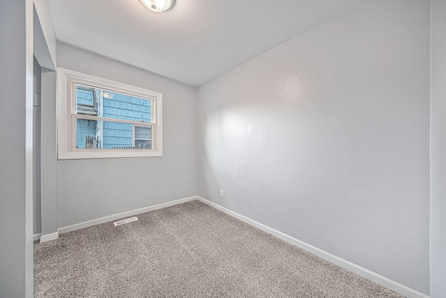 unfurnished room with carpet flooring