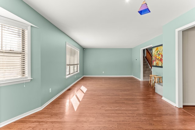 empty room featuring wood-type flooring