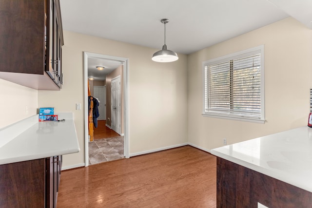 unfurnished dining area with wood-type flooring