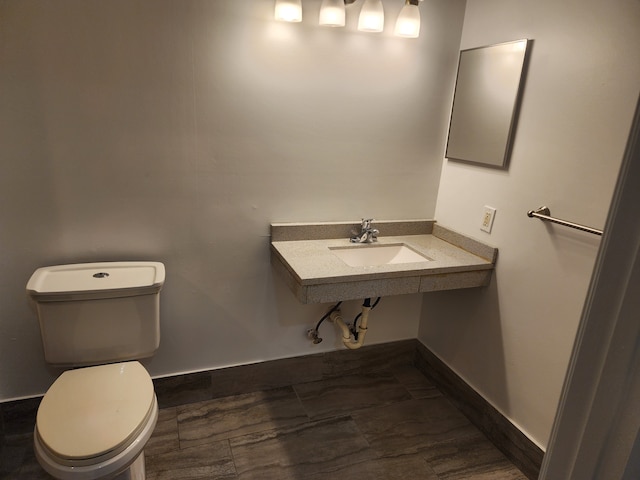 bathroom with toilet and sink