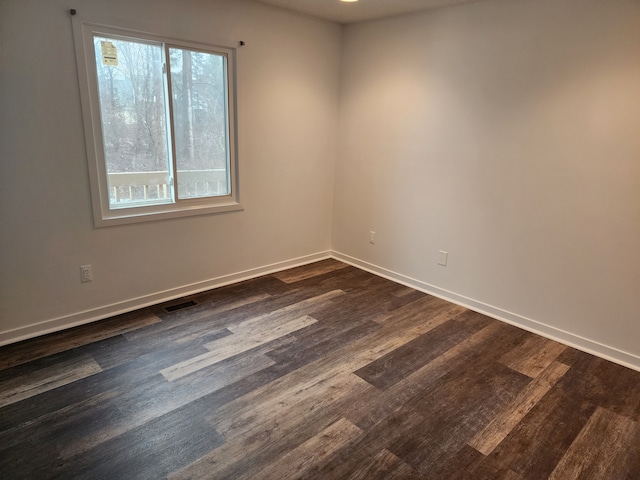 empty room featuring dark hardwood / wood-style floors