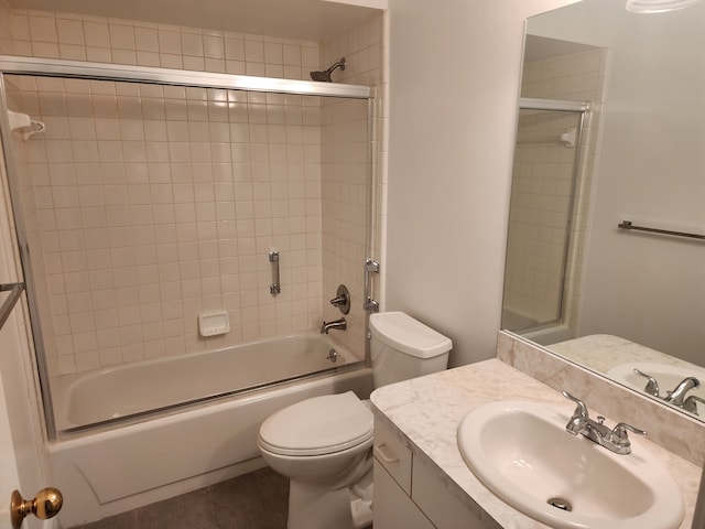 full bathroom featuring vanity, shower / bath combination with glass door, and toilet