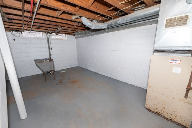 basement featuring heating unit