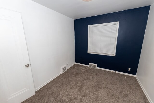 unfurnished room with carpet floors