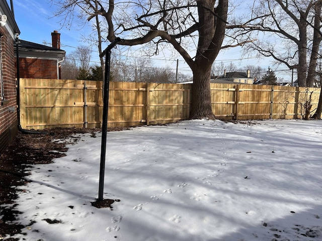 view of yard covered in snow